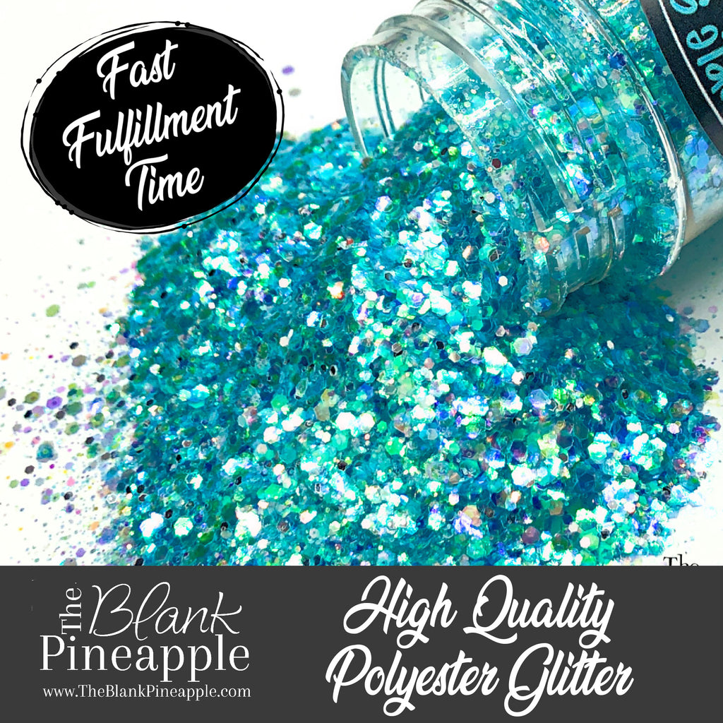 Crystal Blue iridescent mixed glitter in a 2oz shaker bottle, perfect for crafts, resin projects, and nail art. The Blank Pineapple