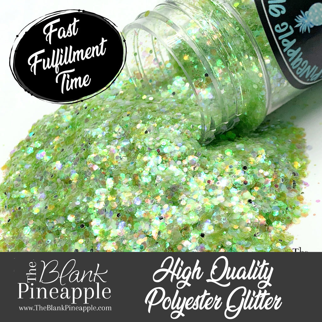 Crystal Green iridescent mixed glitter in a 2oz shaker bottle, perfect for crafts, resin projects, and nail art. The Blank Pineapple