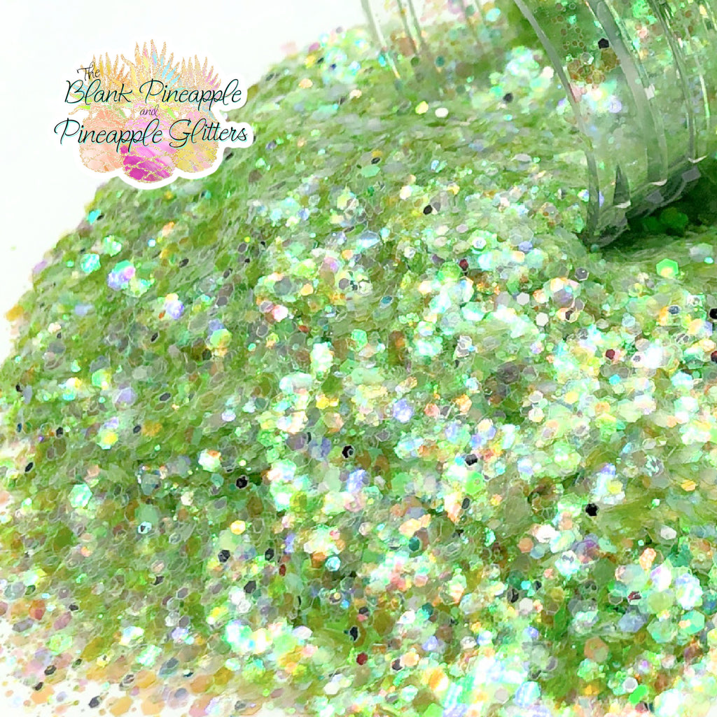 Crystal Green iridescent mixed glitter in a 2oz shaker bottle, perfect for crafts, resin projects, and nail art. The Blank Pineapple