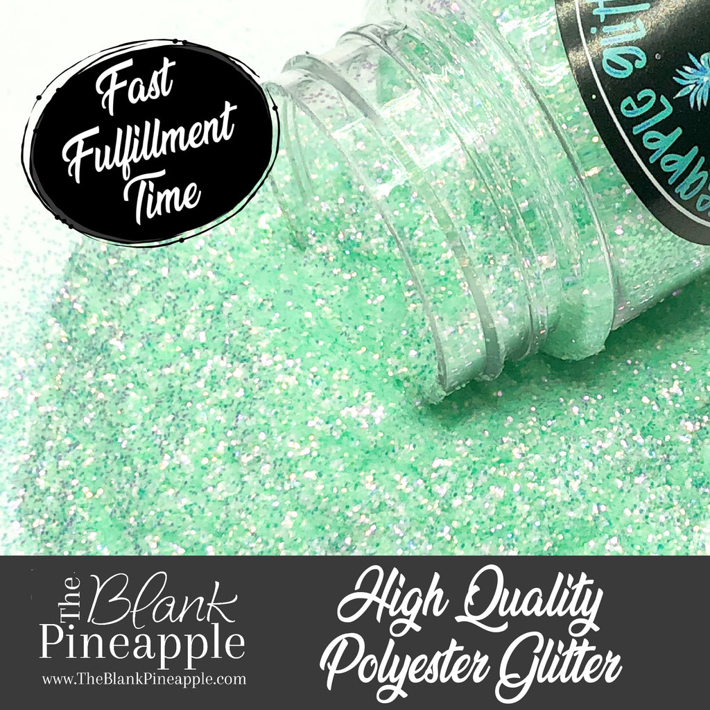 Fairy green fine cut high sparkling iridescent glitter, PET polyester, 2oz shaker bottle for resin projects, tumblers, and nail art. The Blank Pineapple