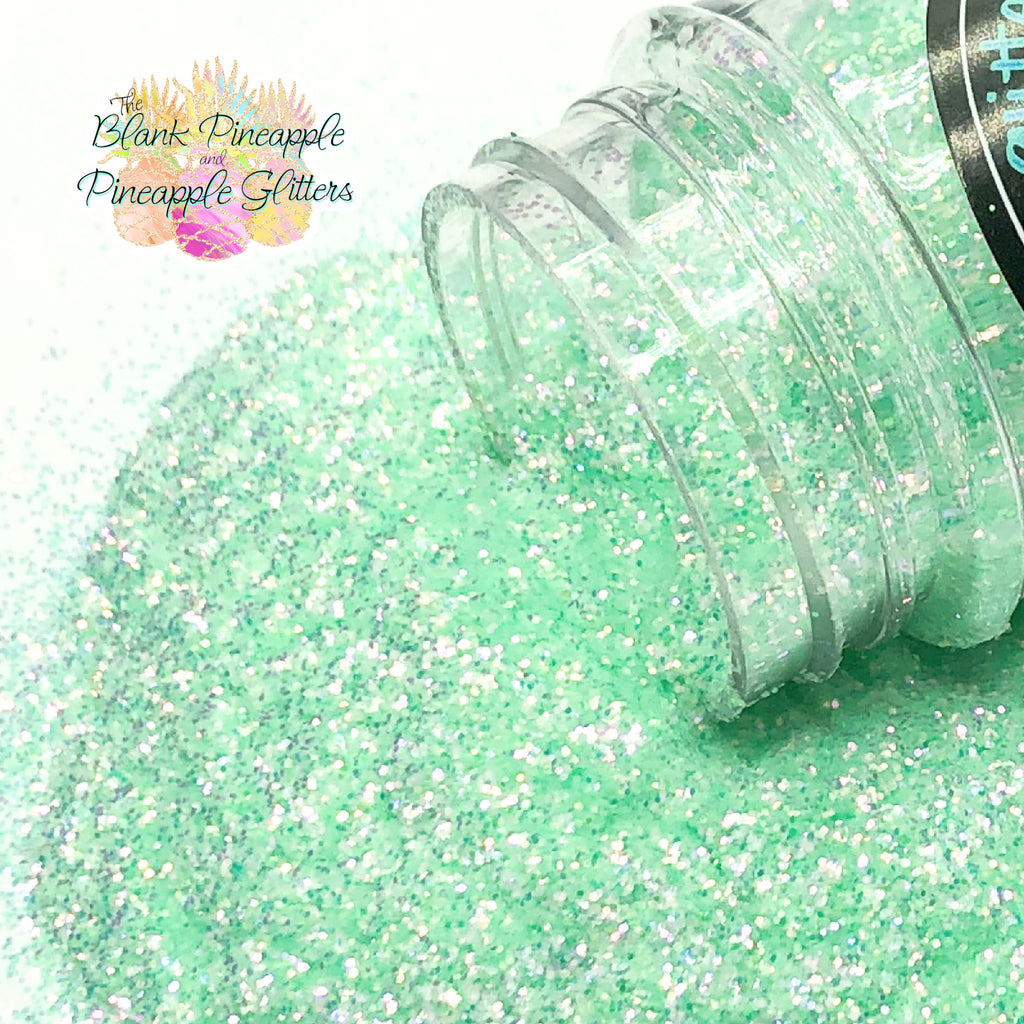 Fairy green fine cut high sparkling iridescent glitter, PET polyester, 2oz shaker bottle for resin projects, tumblers, and nail art. The Blank Pineapple