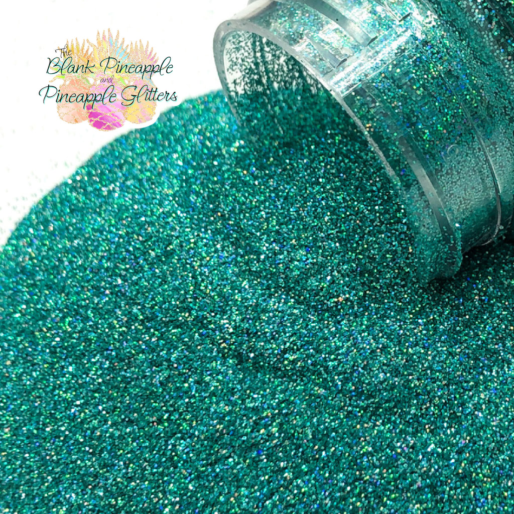 Jade green ultra fine cut holographic glitter, PET polyester, 2oz shaker bottle for crafts, resin projects, and nails. The Blank Pineapple