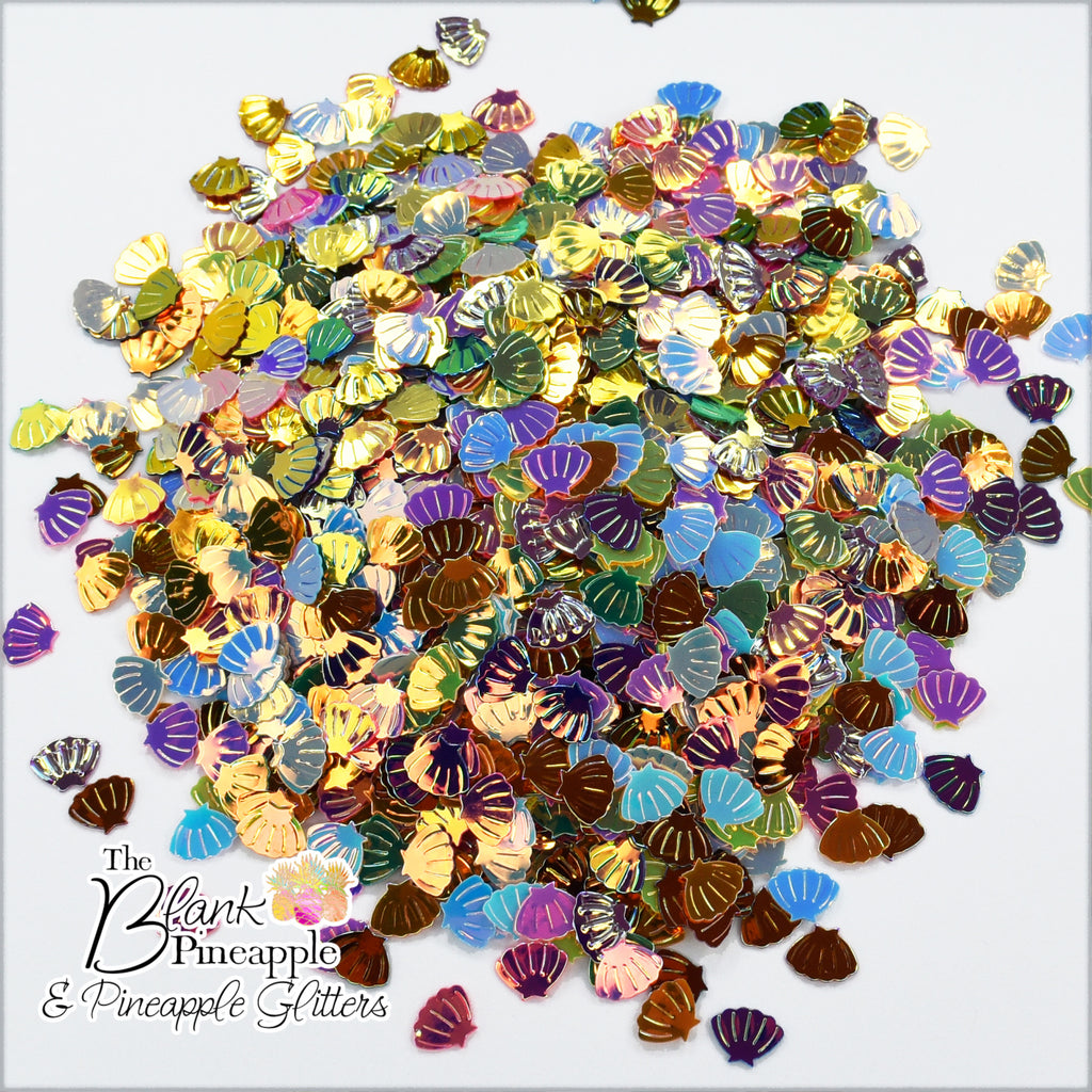 Iridescent PVC seashell-shaped confetti, 2oz bag (56g), perfect for crafts, decor, and parties with a shimmering ocean-inspired finish. - The Blank Pineapple