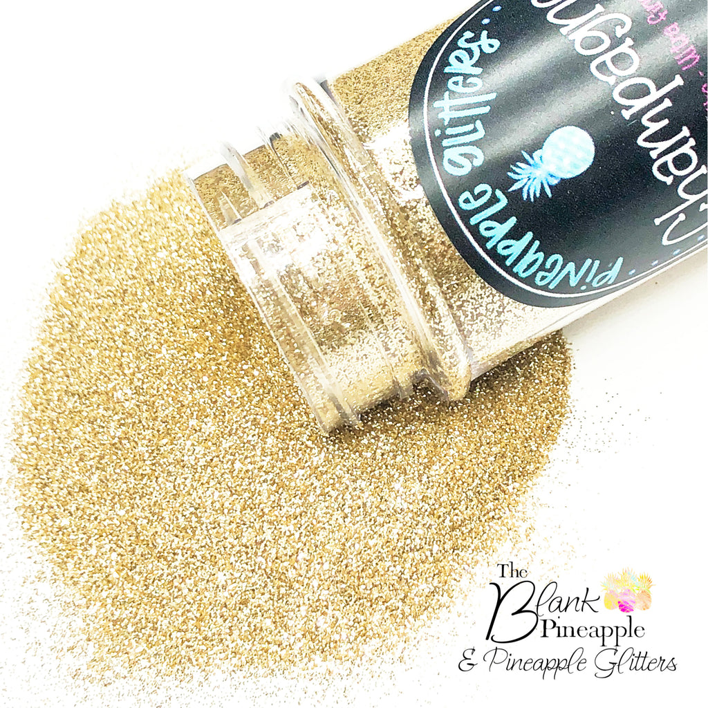 Champagne Gold Glitter in ultra fine cut. Perfect for adding a smooth, shimmering finish to crafts, nails, or resin projects. Pineapple Glitters, The Blank Pineapple. 