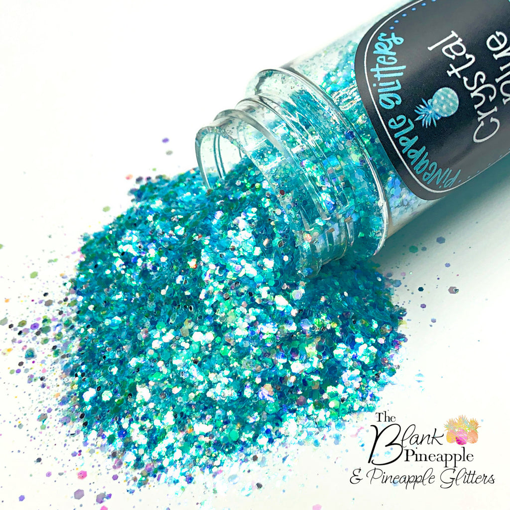 Crystal Blue iridescent mixed glitter in a 2oz shaker bottle, perfect for crafts, resin projects, and nail art. The Blank Pineapple