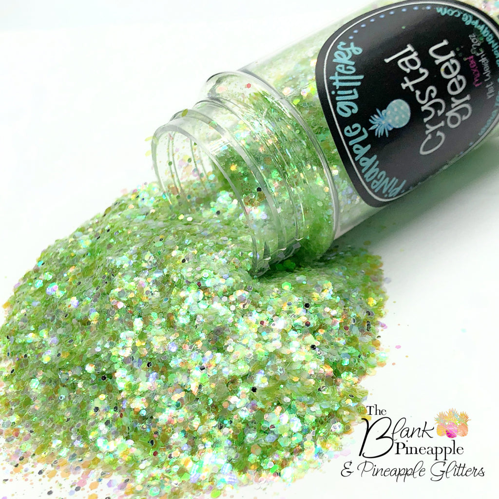 Crystal Green iridescent mixed glitter in a 2oz shaker bottle, perfect for crafts, resin projects, and nail art. The Blank Pineapple