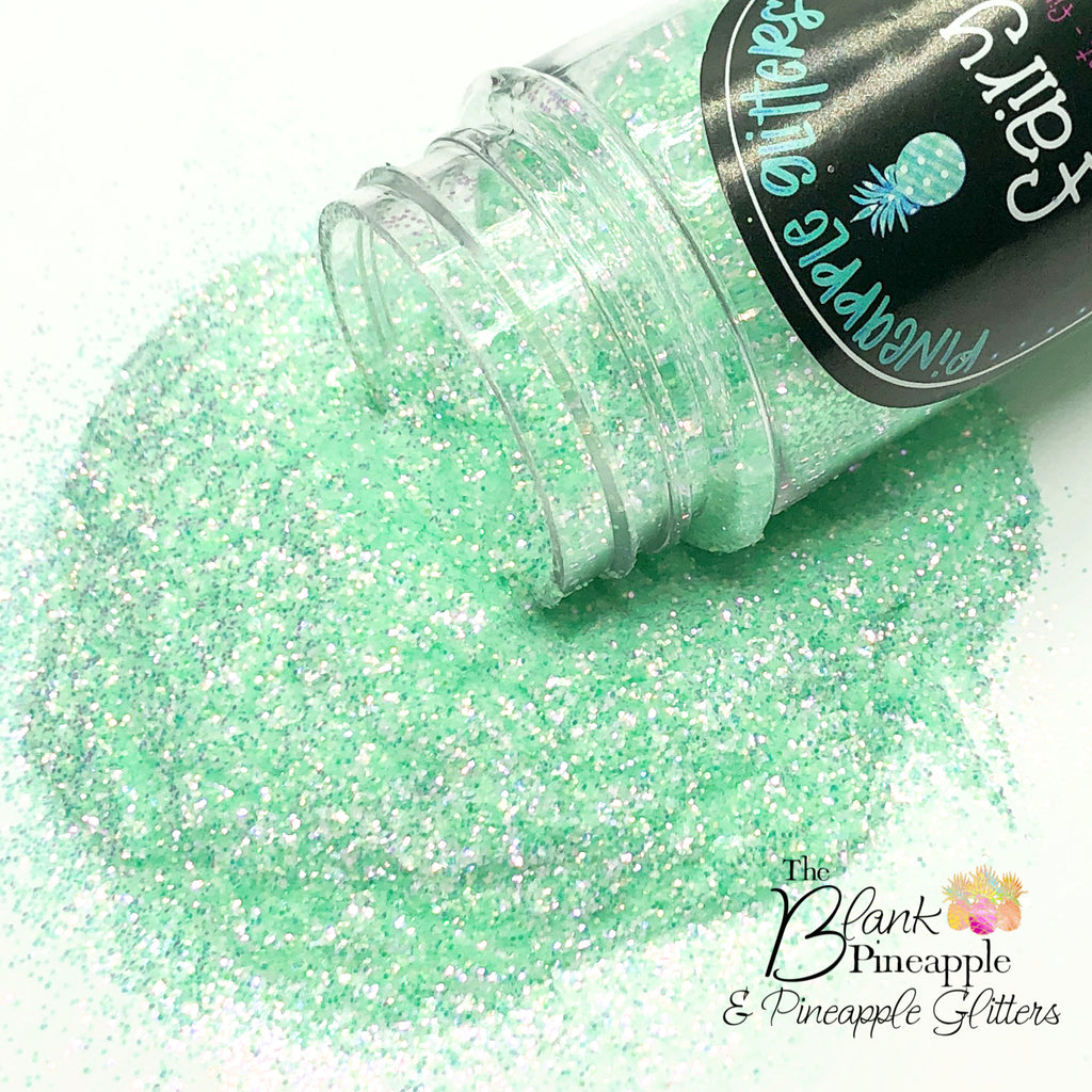 Fairy green fine cut high sparkling iridescent glitter, PET polyester, 2oz shaker bottle for resin projects, tumblers, and nail art. The Blank Pineapple